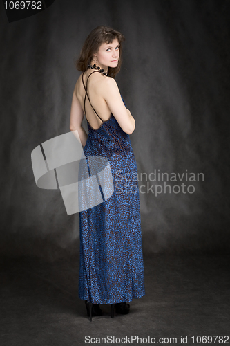 Image of The girl in a dark blue evening dress