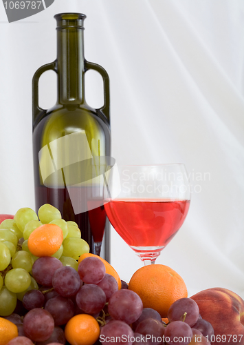 Image of Bright still life with wine and fruit