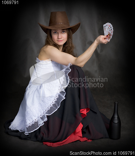 Image of Girl with a playing-cards in hand