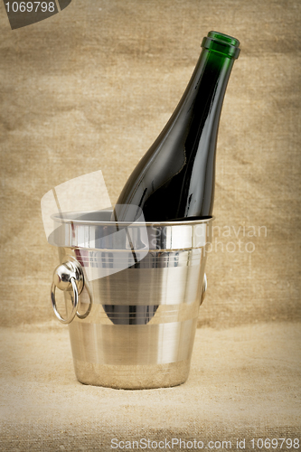 Image of Champagne bottle in metallic bucket