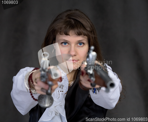 Image of Girl - pirate with two ancient pistols in hands