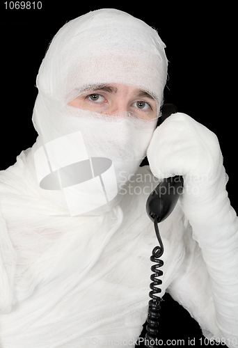 Image of Mummy-businessman calling on phone