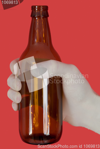 Image of Brown bottle on hand