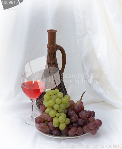 Image of Bright still life with wine on white