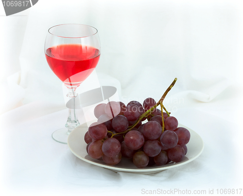 Image of Still-life with a glass of red wine and grapes