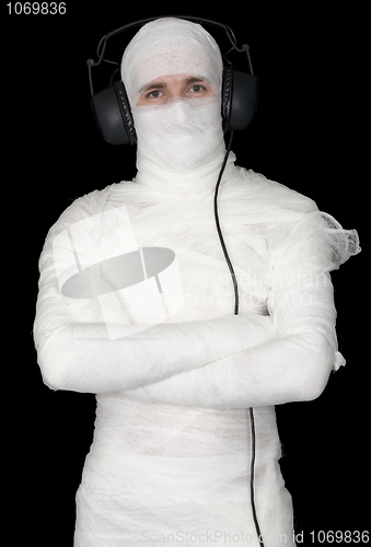 Image of Man in bandage with ear-phones 