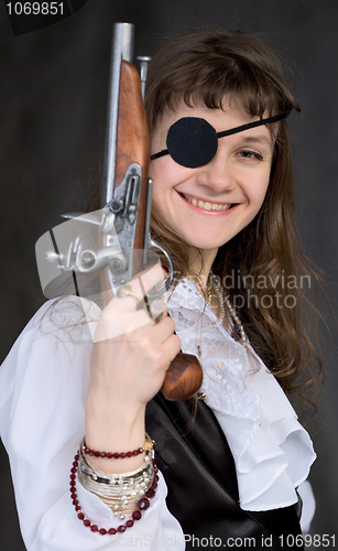 Image of Girl - pirate with pistol in hand and eye patch