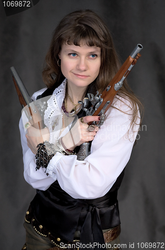 Image of Girl - pirate with two ancient pistols in hands