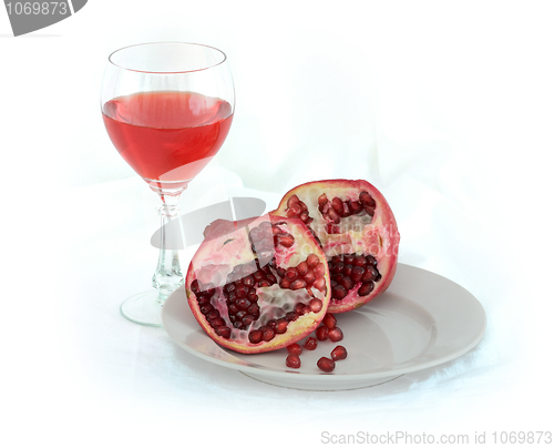 Image of Still-life with a glass of wine and pomegranate