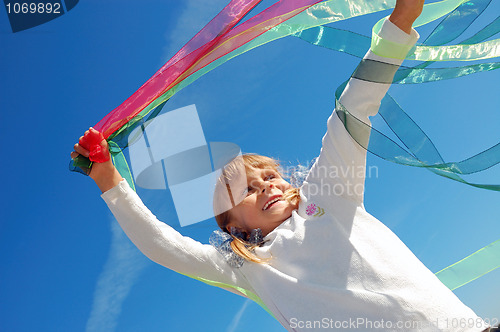 Image of child playing with ribbons