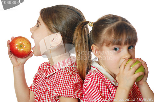 Image of two girls eating apples