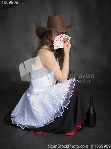 Image of Girl with a playing-cards in hand