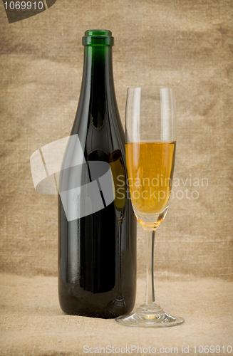 Image of The champagne bottle and glass