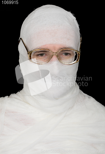 Image of Sorrowful bandaged men in spectacles