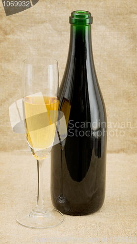 Image of The champagne bottle and glass