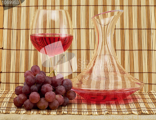 Image of Still life with decanter, goblet and grapes