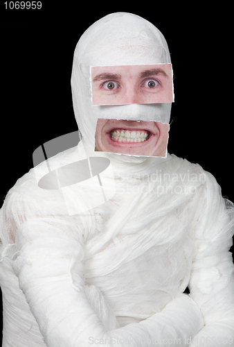 Image of Bandaged man with false paper face