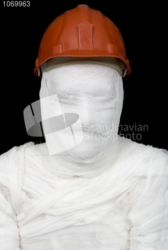 Image of Bandaged worker in helmet