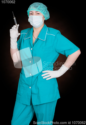 Image of Nurse with syringe in hand