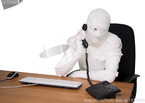 Image of Bandaged man in office