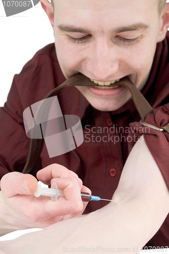 Image of Young man to give an injection himself