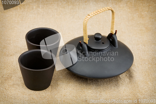 Image of Black ceramic chinese teapot and mugs