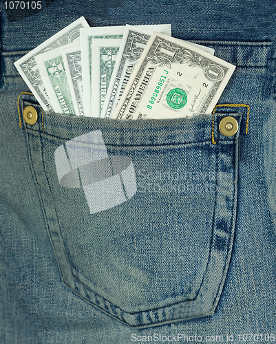 Image of Dollars in hip-pocket on jeans