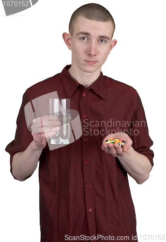 Image of Guy with glass of water and tablets