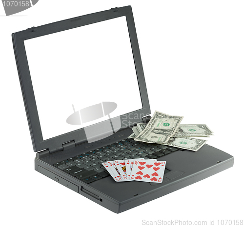 Image of Laptop with playing card and money