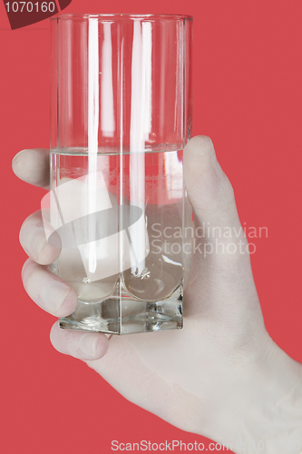 Image of Glass of water on hand