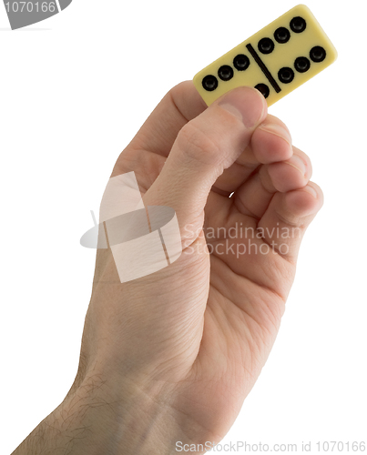 Image of Bone dominoes on hand