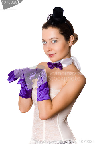 Image of  woman in corset, gloves and little hat