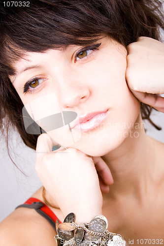 Image of brunette lady with bracelets