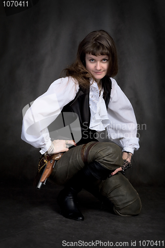 Image of Girl - pirate with pistol sit on black