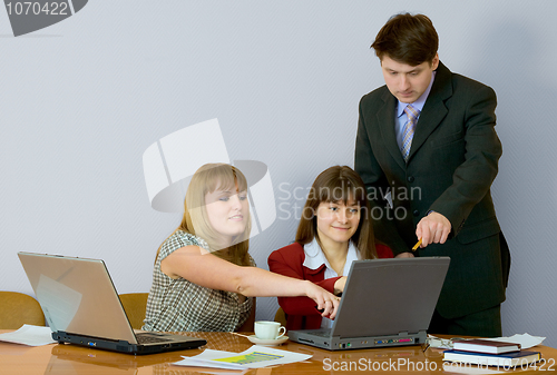 Image of Girls at a desktop and their chief