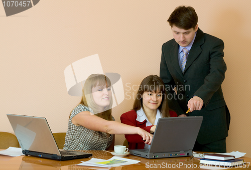 Image of Girls at a desktop and their chief