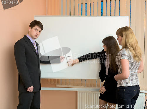 Image of Office workers discuss work