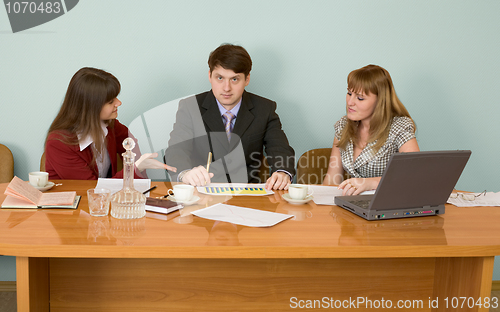 Image of Business team sits at the table