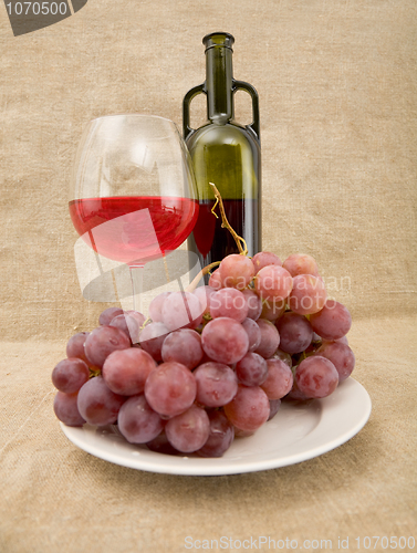 Image of Bottle, gapes and goblet