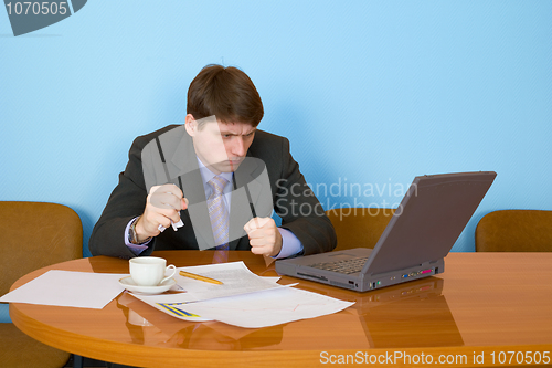 Image of Businessman on a workplace with the laptop