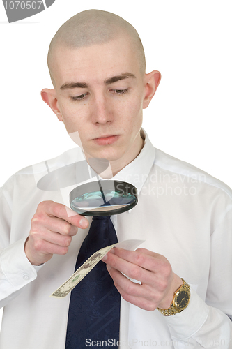 Image of Man studying a counterfeit money