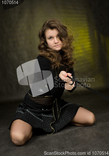 Image of Girl in black on dark background
