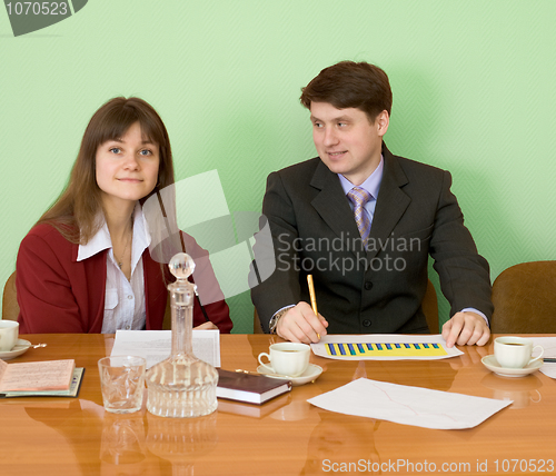 Image of Business team sits at the table