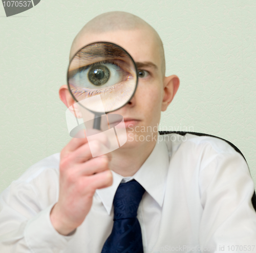 Image of Guy looks through the big magnifier