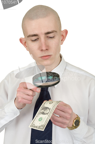 Image of Man studying a counterfeit money