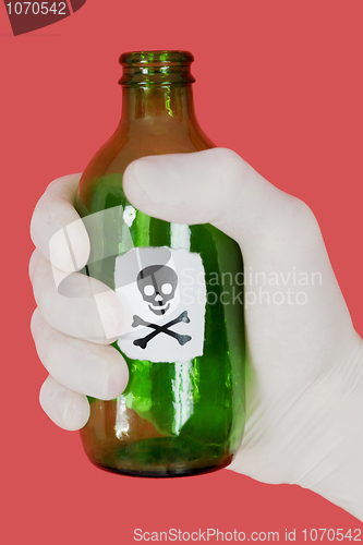 Image of Green bottle with skull and crossbones