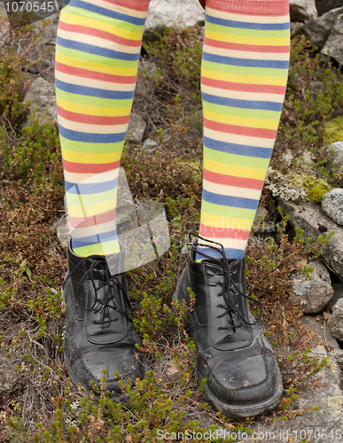 Image of Amusing striped feet in boots