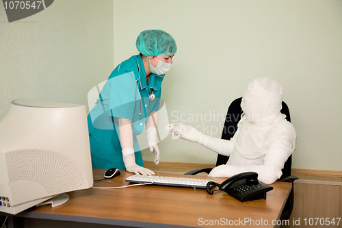 Image of The bandaged boss and nurse