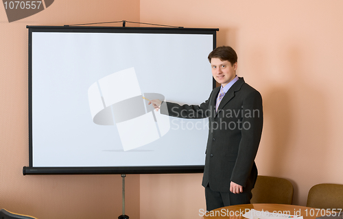 Image of Businessman near the white screen