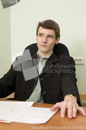 Image of Clerk at office sits at a desktop